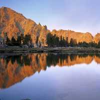 White Cloud peaks reflect into a small lake on the Windy  Devil Pass in the Sawtooth National Forest