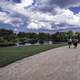 People walking on the path under the clouds landscape