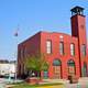 Historic fire station with patchwork quilt designs on doors in Indiana