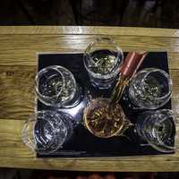 Pouring Whiskey into glasses at Maker's Mark