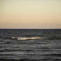 Waters of Lake Michigan and horizon at Dusk at J.W. Wells State Park, Michigan