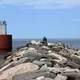 Closer view of people and lighthouse at McClain State Park, Michigan