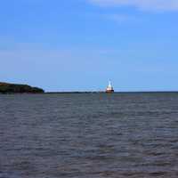 Lighthouse in the distance in McLain State Park, Michigan