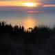 Sunset over lake and forest at Pictured Rocks National Lakeshore, Michigan