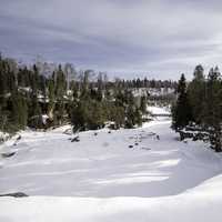Frozen Gooseberry River landscape covered in Snow at Gooseberry Falls State Park, Minnesota