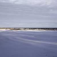 Horizon with snowy landscape and lake Superior at Gooseberry Falls State Park, Minnesota