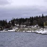 Winter shoreline and pine forest in Grand Marais, Minnesota