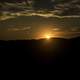 Sunset beyond hills at Great River Bluffs State Park