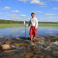 Claiming the Mississippi River at lake Itasca state park, Minnesota