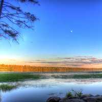 Dusk with moon in the sky at lake Itasca state park, Minnesota