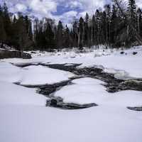 Rapids in the snowy river in Temperance River State Park, Minnesota