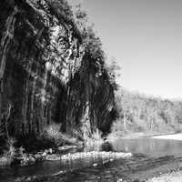 Monochrome photo of current river and cliff at Echo Bluff State Park, Missouri