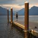 Women at the dock looking at Mountain Landscape at Glacier National Park, Montana