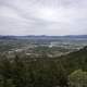 Far off Helena from Mount Ascension under grey skies in Helena