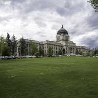 Montana State Capital under the clouds with lawn in Helena