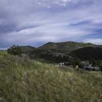 Mountain grasses landscape with hills with clouds and sky in Helena