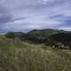 Mountain grasses landscape with hills with clouds and sky in Helena