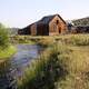 Homestead next to a creek landscape