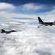 Planes flying high above the clouds