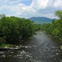 Mount Ascutney Landscape with clouds and River in Claremont, New Hampshire