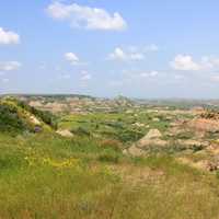 Grassland landscape with badlands in the distance at Theodore Roosevelt National Park, North Dakota