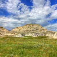 Scattered clouds over a peak at White Butte, North Dakota