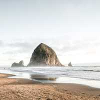 Large Rock rising out of the sea at Cannon Beach, Oregon