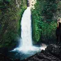 Women watching the waterfall in Oregon