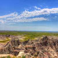 Buttes under clouds and skies at Badlands National Park, South Dakota