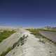 Road through the badlands to the horizon