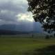  Women sitting under tree under heavy clouds in Great Smoky Mountains National Park, Tennessee