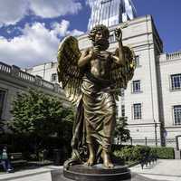 Statue in front of buildings in downtown Nashville