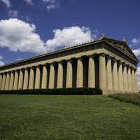View of the Parthenon of Nashville under blue skies and clouds