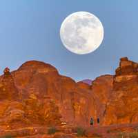 Supermoon center stage above the rock formations