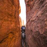 Tight Squeeze through the cliffs in Arches National Park