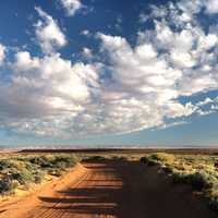 Path under the clouds in Utah near Hanksville