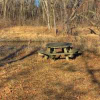 Picnic table by the River on the 400 trail in Wisconsin