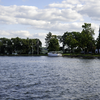 Boat on Green lake with clouds