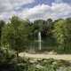 Landscape with pond and fountain in garden