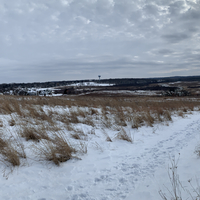 Winter snow landscape under clouds