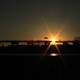 Sun behind highway bridge in Milwaukee, Wisconsin