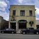 The Grumpy Troll Tavern with cars in front in Mount Horeb