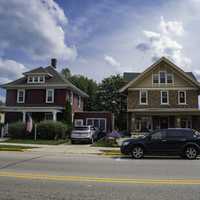 Houses in Mount Horeb under the clouds and sky with cars in front