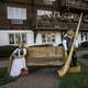 Two Statues on a bench by the hotel in New Glarus