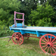 Blue farm cart with Red Wheels