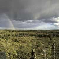 Landscape Panorama with Rainbow with rain clouds from Quincy Bluff, WIsconsin