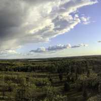 Panorama of landscape with trees, sky, and clouds at Quincy Bluff, Wisconsin