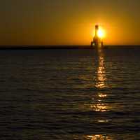 Sun Behind the Lighthouse at Port Washington, Wisconsin