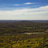 Scenic Mountain Landscape with Autumn Leaves under the sky