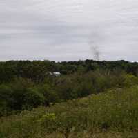 Autumn landscape with smoke coming from Chimney